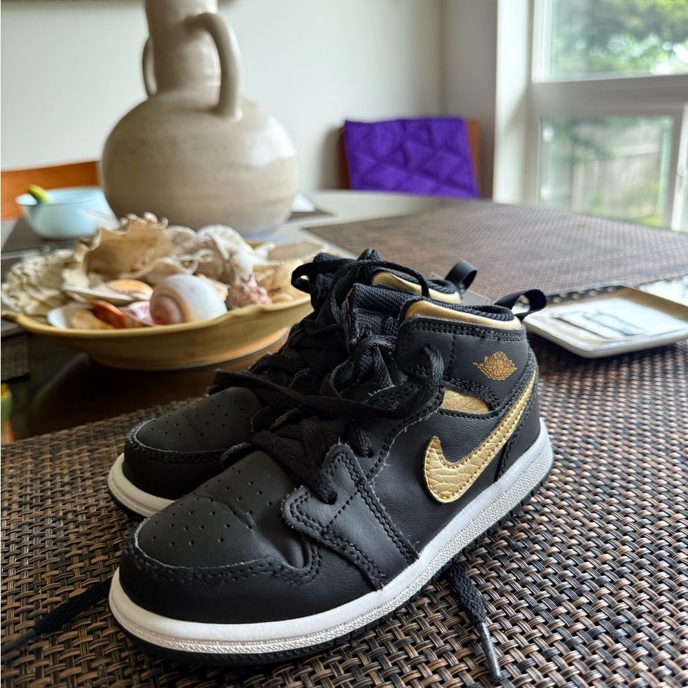 Air Jordan’s size 9.5 C toddler Black and Gold